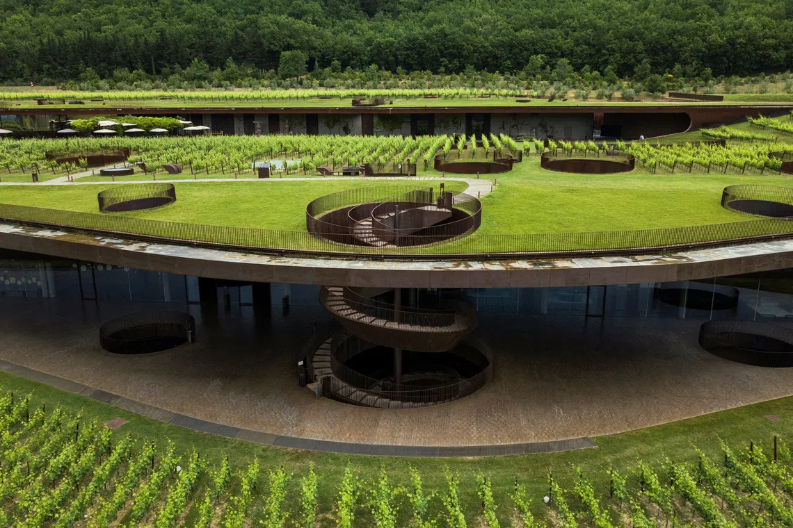 A drone view shows the Marchesi Antinori winery surrounded by vineyards in Bargino, near Florence, Italy, in this undated handout image. Marchesi Antinori Press/Handout via REUTERS
