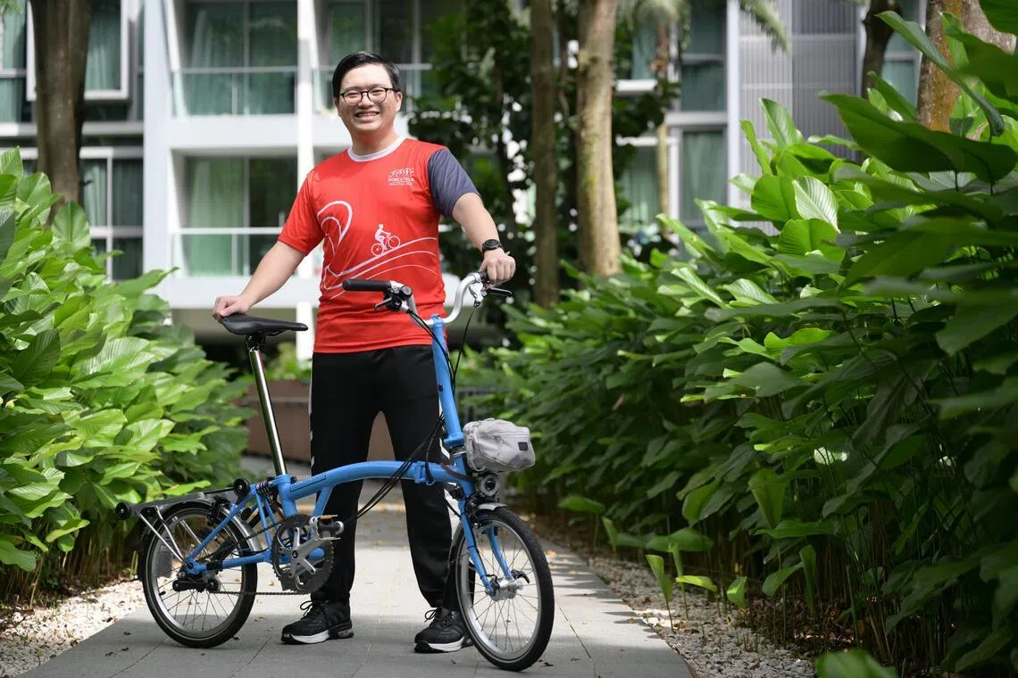 Bicycle enthusiast Jason Loo with the Brompton C Line bike that he won as part of a giveaway contest organised by the OCBC Cycle and The Straits Times.