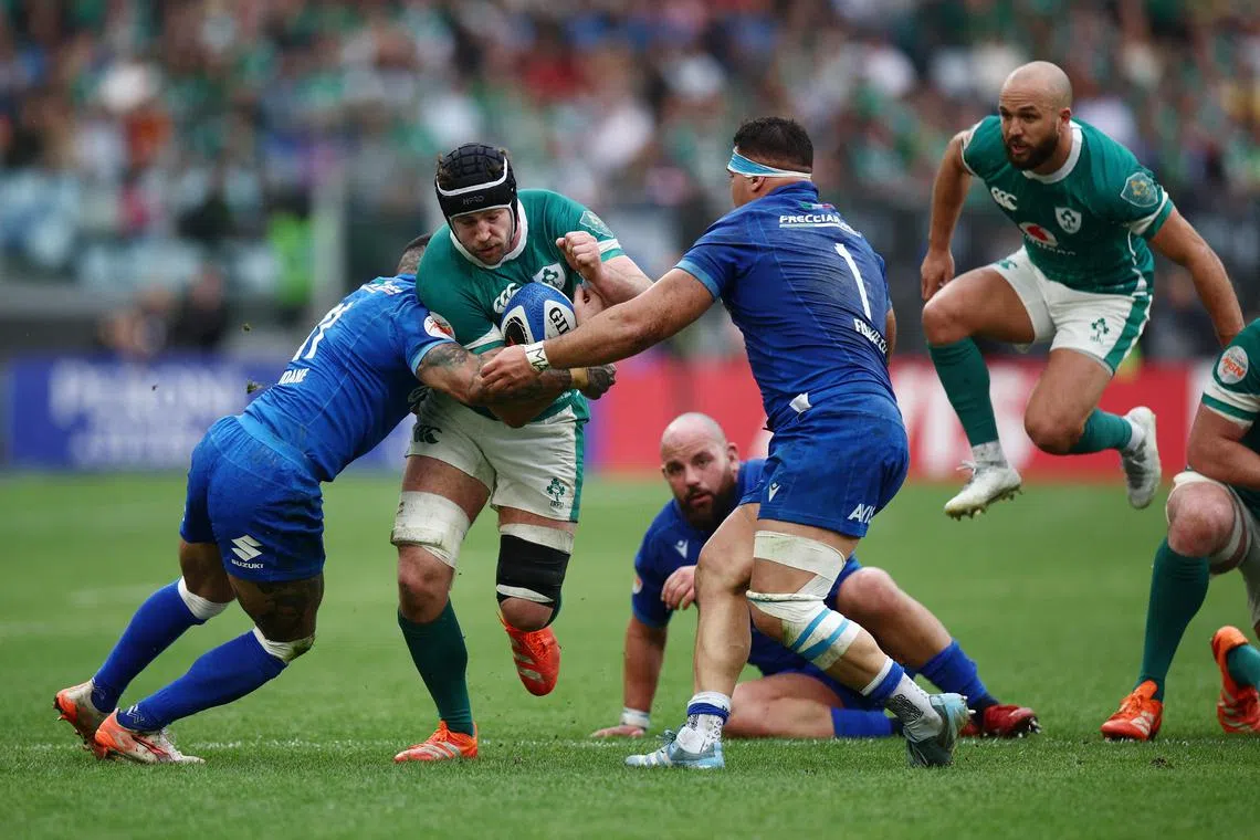 FILE PHOTO: Rugby Union - Six Nations Championship - Italy v Ireland - Stadio Olimpico, Rome, Italy - March 15, 2025 Ireland's Caelan Doris in action with Italy's Monty Ioane and Danilo Fischetti REUTERS/Guglielmo Mangiapane/File Photo