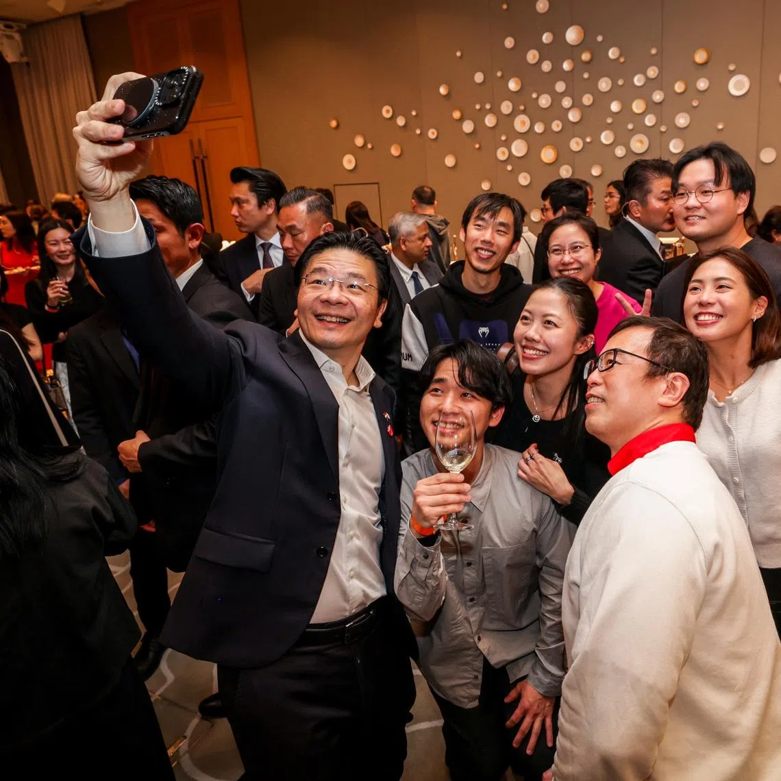 Prime Minister Lawrence Wong met some 500 overseas Singaporeans and their families at a reception in Tokyo on March 17.