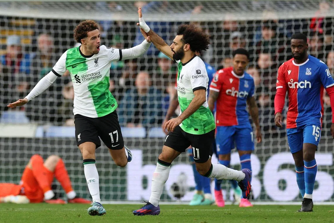 Liverpool's Mohamed Salah (centre) celebrates with teammate Curtis Jones after scoring their first goal against Crystal Palace.