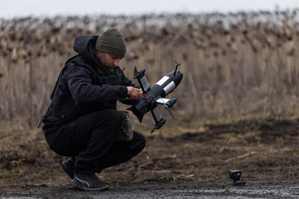 A Ukrainian soldier prepares a P1-Sun drone interceptor, which costs around around US$1,000 (S$1,278) each.
