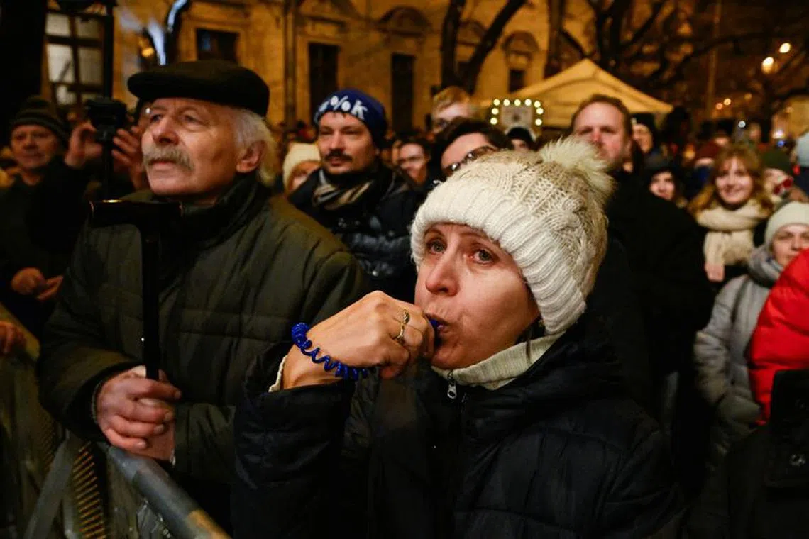 Demonstrators take part in a protest against the government's plan to scrap a special prosecutor's office, in Bratislava, Slovakia, December 19, 2023. REUTERS/Radovan Stoklasa