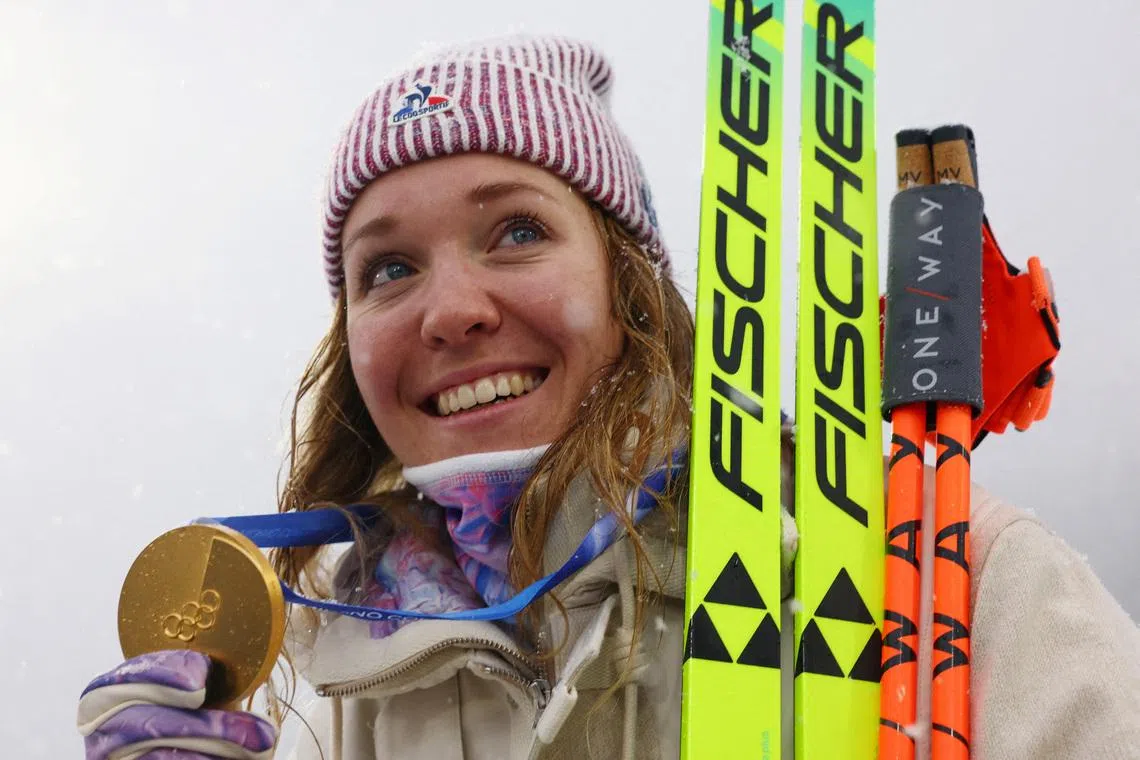 Milano Cortina 2026 Olympics - Biathlon - Women's 12.5km Mass Start Victory Ceremony - Anterselva Biathlon Arena, South Tyrol, Italy - February 21, 2026. Gold medallist Oceane Michelon of France celebrates during the women's 12.5km mass start victory ceremony REUTERS/Matthew Childs