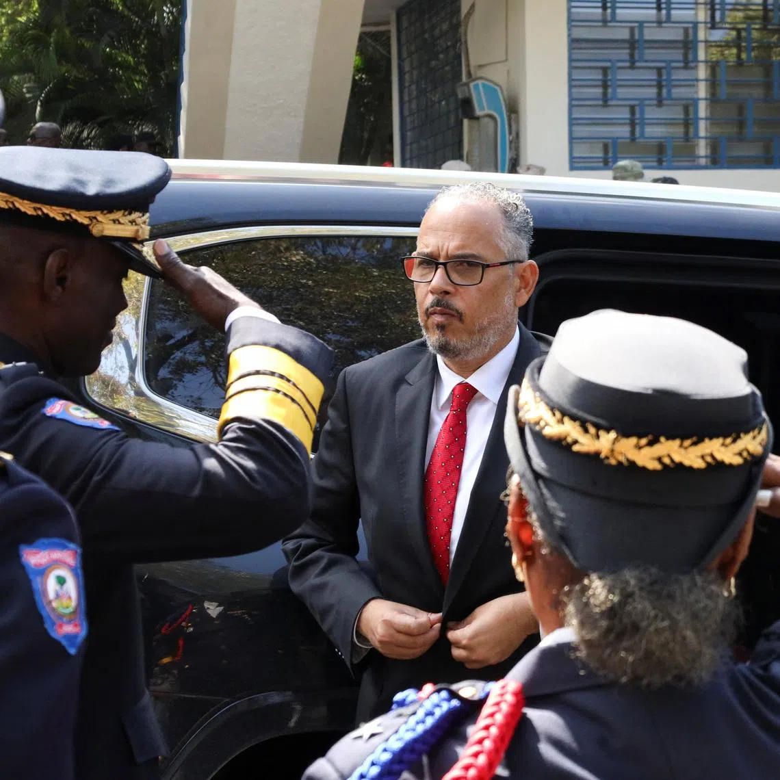 Haiti's Prime Minister Alix Didier Fils‑Aime arrives at a police graduation ceremony as Transitional Presidential Council members Leslie Voltaire and Edgard Leblanc Fils seek to proceed with a plan to remove Fils‑Aime within 30 days following established procedures, despite U.S. warnings that such a move would have consequences, in Port‑au‑Prince, Haiti, January 23, 2026. REUTERS/Fildor Pq Egeder