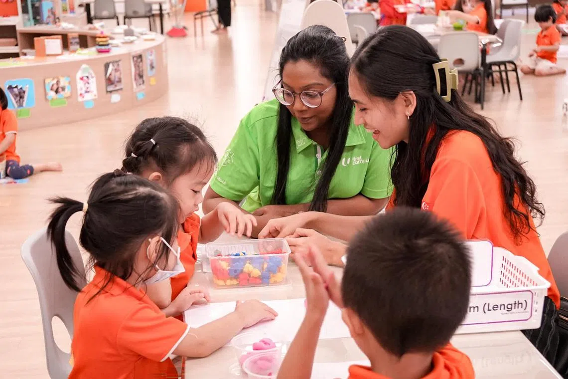 etfund26 - Ms Vishaalini Vasanthanathan, NTUC First Campus's Development Support Specialist (in green shirt), and Oblena Angela Mari Zulueta, English Teacher at My First Skool at 49 Rivervale Crescent (far right) engaging 4-year-old Evelyn Lai (left) and her classmates in an activity sorting colours.



Credit: NTUC First Campus