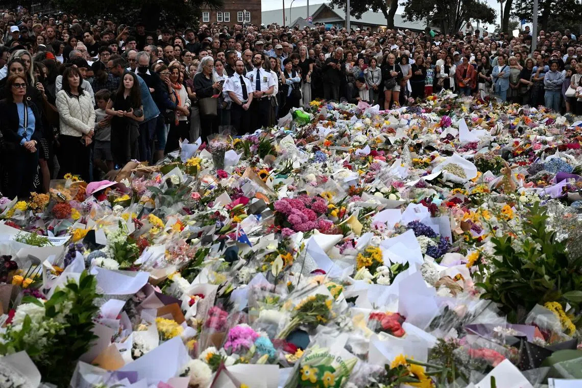 Mourners gather at a tribute at the Bondi Pavilion in memory of the victims of a shooting at Bondi Beach, in Sydney, on Dec 16, 2025. 