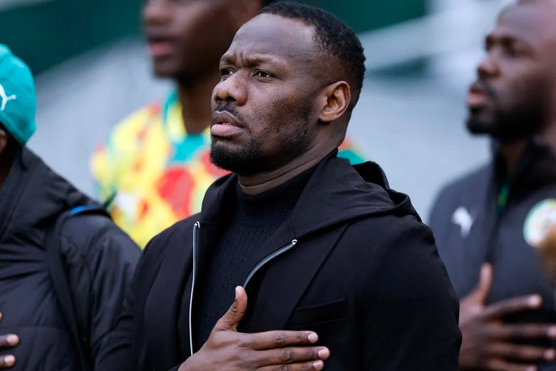 Soccer Football - International Friendly - Republic of Ireland v Senegal - Aviva Stadium, Dublin, Ireland - June 6, 2025 Senegal coach Pape Bouna Thiaw during the national anthems before the match REUTERS/Clodagh Kilcoyne/File Photo