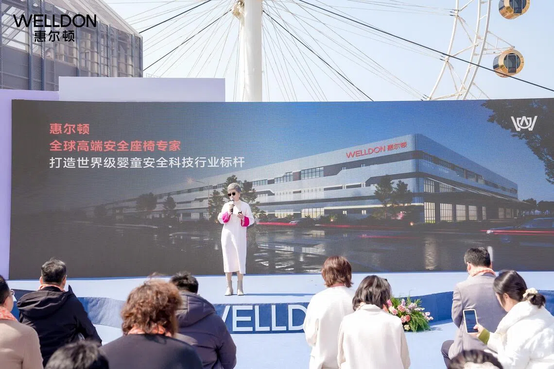 Welldon founder Monica Lin speaking on stage at the launch of the company’s new child safety car seats in Ningbo, China, in March 2026.