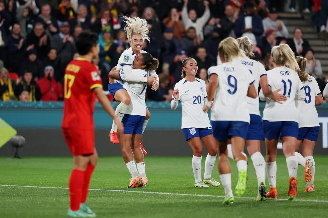 England's Lauren James celebrates scoring their third goal against China with Alex Greenwood and Katie Zelem.
