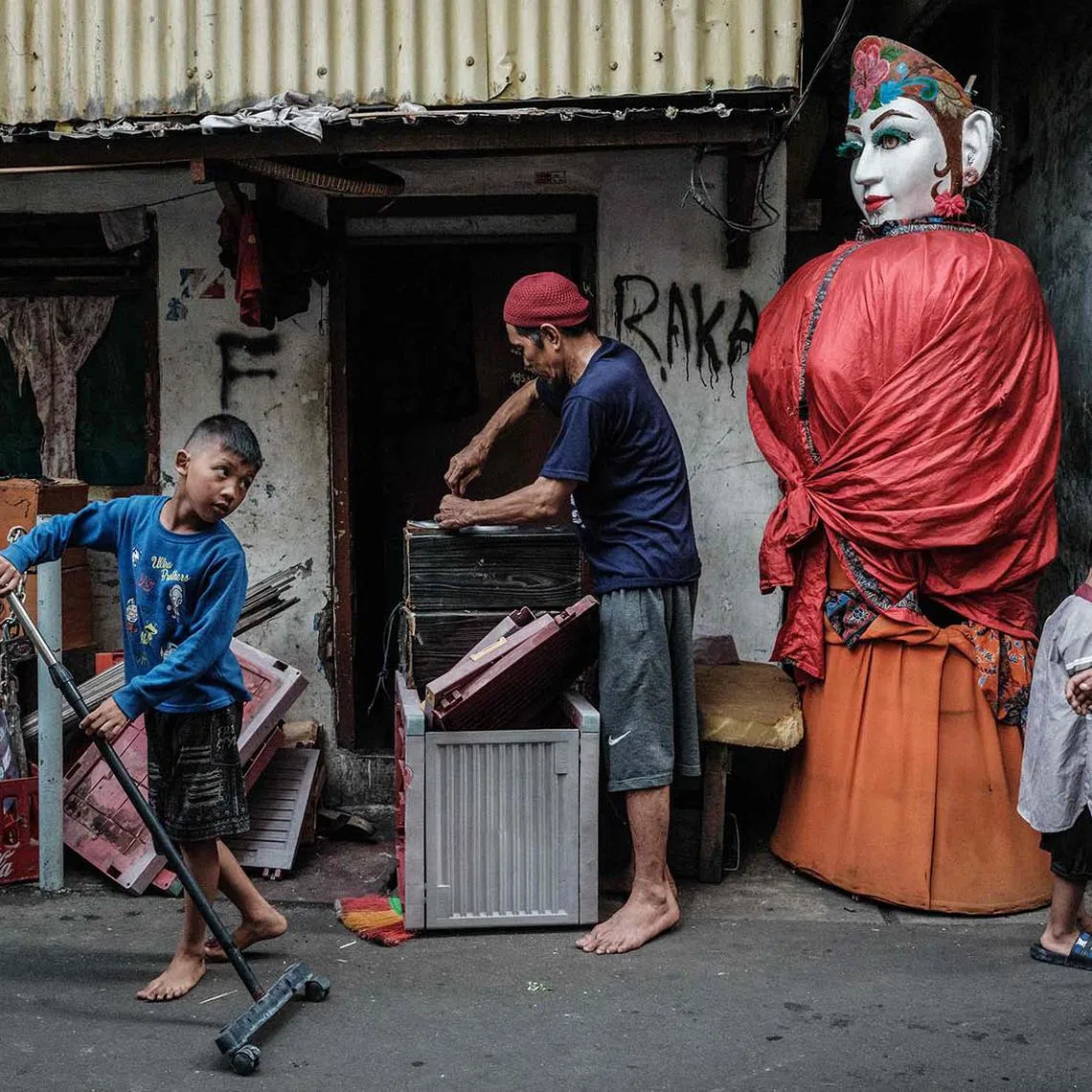 An ondel-ondel puppet is seen in an alley in Jakarta on May 4, 2025. It is set to be banned from street performances as part of a broader move to recognise and elevate Betawi culture.