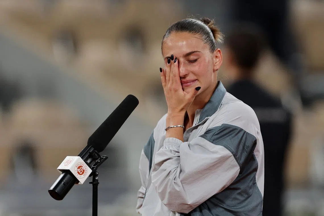 Tennis - French Open - Roland Garros, Paris, France - June 2, 2026 Ukraine's Marta Kostyuk reacts during the post match interview with former player Marion Bartoli after winning her quarter final match against Ukraine's Elina Svitolina REUTERS/Stephanie Lecocq