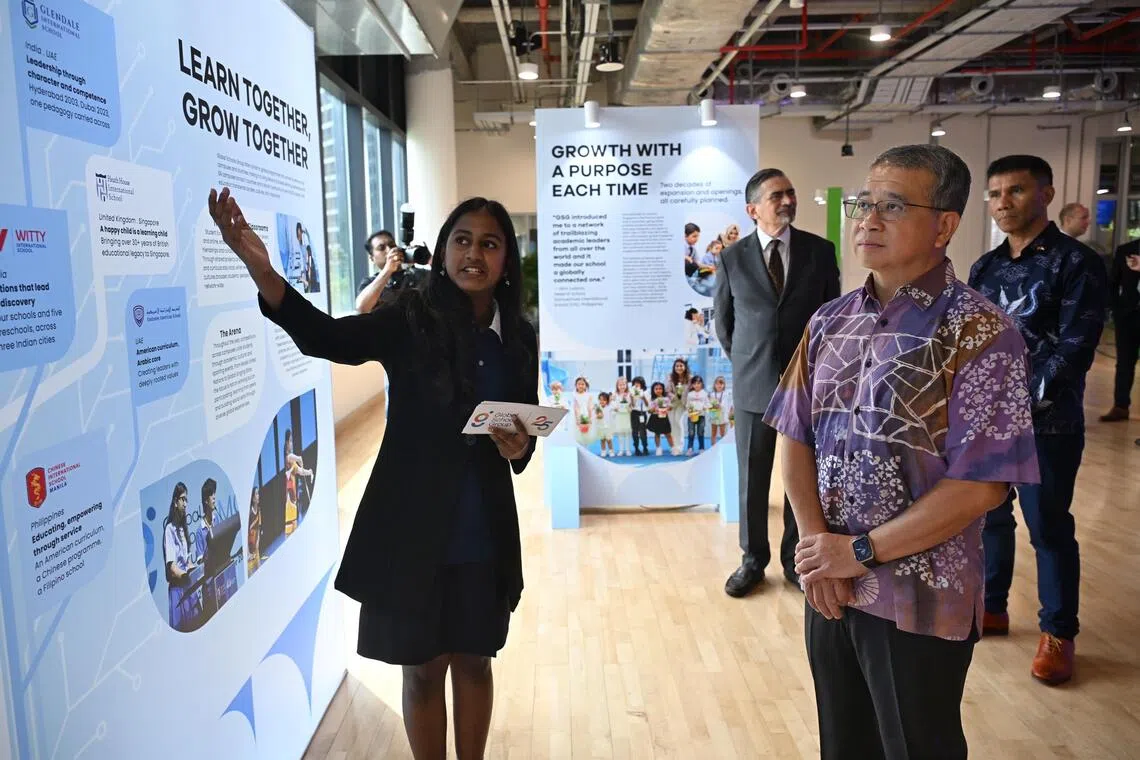 Law Minister Edwin Tong (right) touring the exhibits at the One World International School on Sept 18.