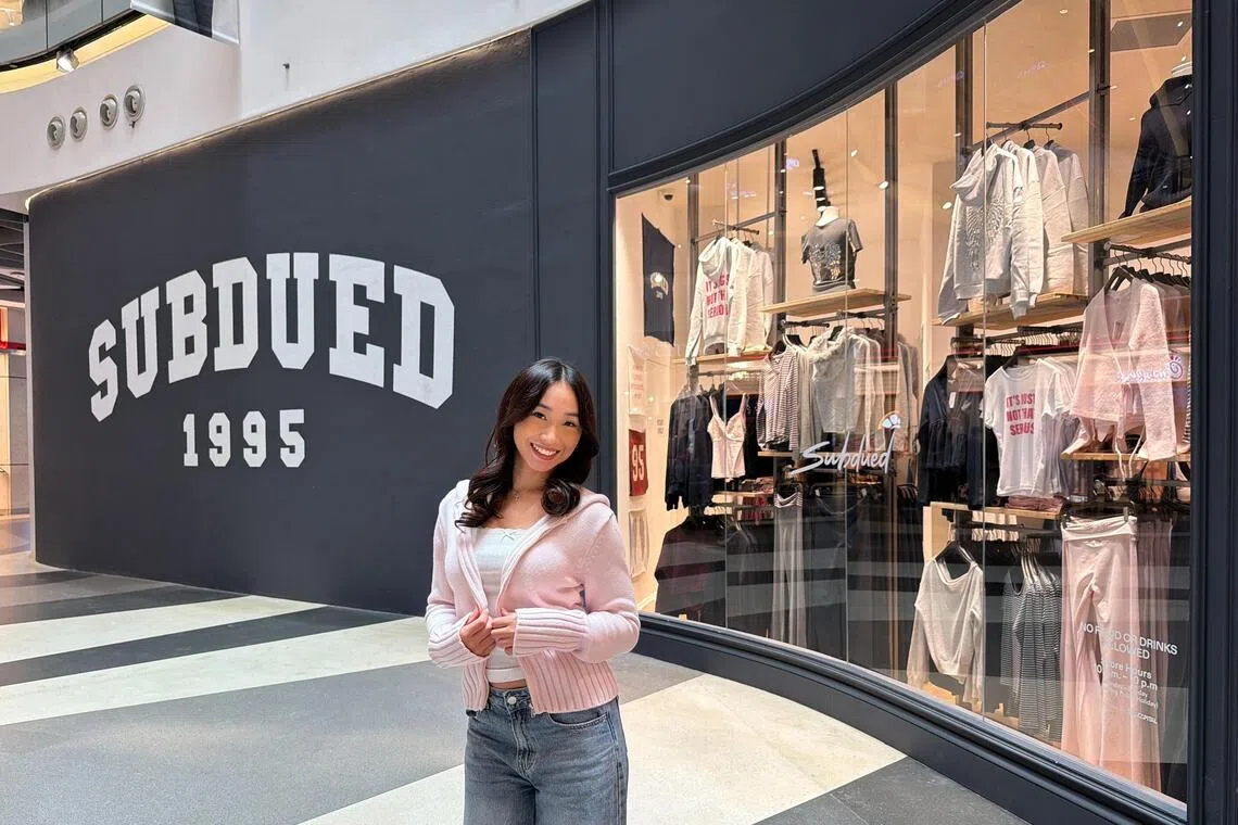 Content creator Sarah Lim, 20, outside Subdued’s Bugis+ store in a pink knit jacket from the label, which she wears almost every day.