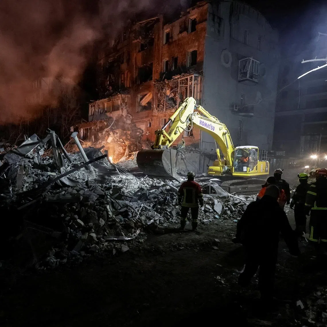 FILE PHOTO: Rescuers work at the site of an apartment building hit by a Russian air strike, amid Russia's attack on Ukraine, in Kharkiv, Ukraine January 2, 2026. REUTERS/Sofia Gatilova /File Photo