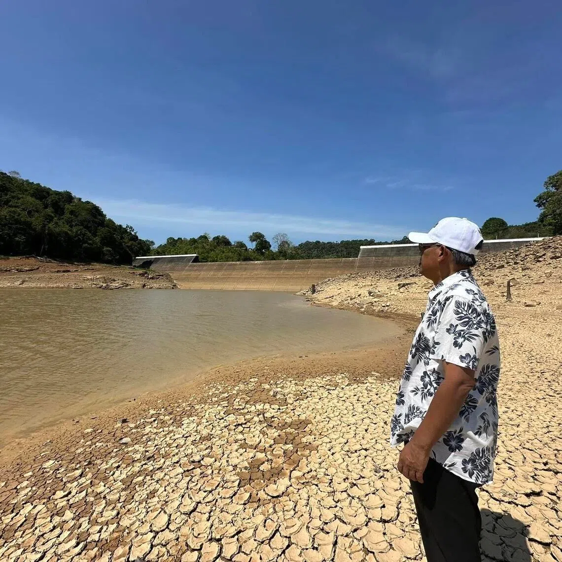 Photos posted online on March 25 by Datuk Ismail Salleh, who chairs the Muda river basin’s agricultural development board, showed receding water levels and parched ground on the banks