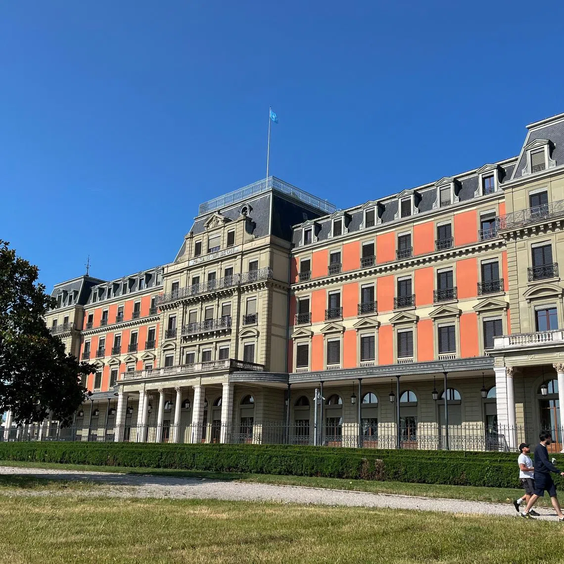 People walk past the Palais Wilson, base of the U.N. High Commissioner for Human Rights, and the former headquarters of the League of Nations, in Geneva, Switzerland, June 17, 2025. REUTERS/Emma Farge