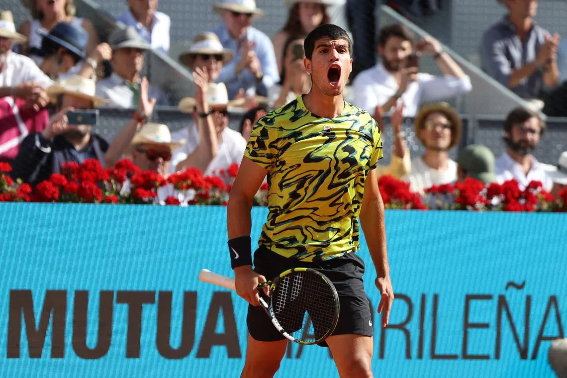 Spain's Carlos Alcaraz celebrates beating Croatia's Borna Coric after their 2023 ATP Tour Madrid Open tennis tournament.