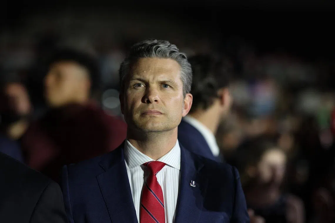 WARREN, MICHIGAN - APRIL 29: Defense Secretary Pete Hegseth listens as President Donald Trump speaks during a rally at Macomb Community College on April 29, 2025 at Warren, Michigan. Trump held the rally to highlight his accomplishments during his first 100 days in office, including closing the border, job creation and the economy. Scott Olson/Getty Images/AFP (Photo by SCOTT OLSON / GETTY IMAGES NORTH AMERICA / Getty Images via AFP)