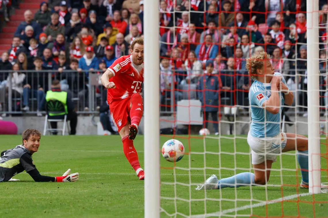 Soccer Football - Bundesliga - Bayern Munich v 1. FC Union Berlin - Allianz Arena, Munich, Germany - March 21, 2026 Bayern Munich's Harry Kane shoots at goal REUTERS/Michaela Stache
