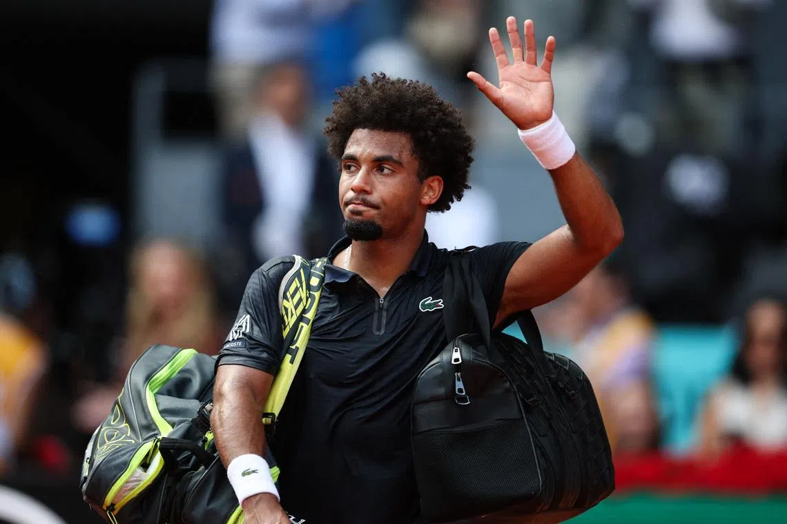 Tennis - Madrid Open - Park Manzanares, Madrid, Spain - May 1, 2026 France's Arthur Fils waves to the crowd as he leaves the court after losing his semi final match against Italy's Jannik Sinner REUTERS/Isabel Infantes