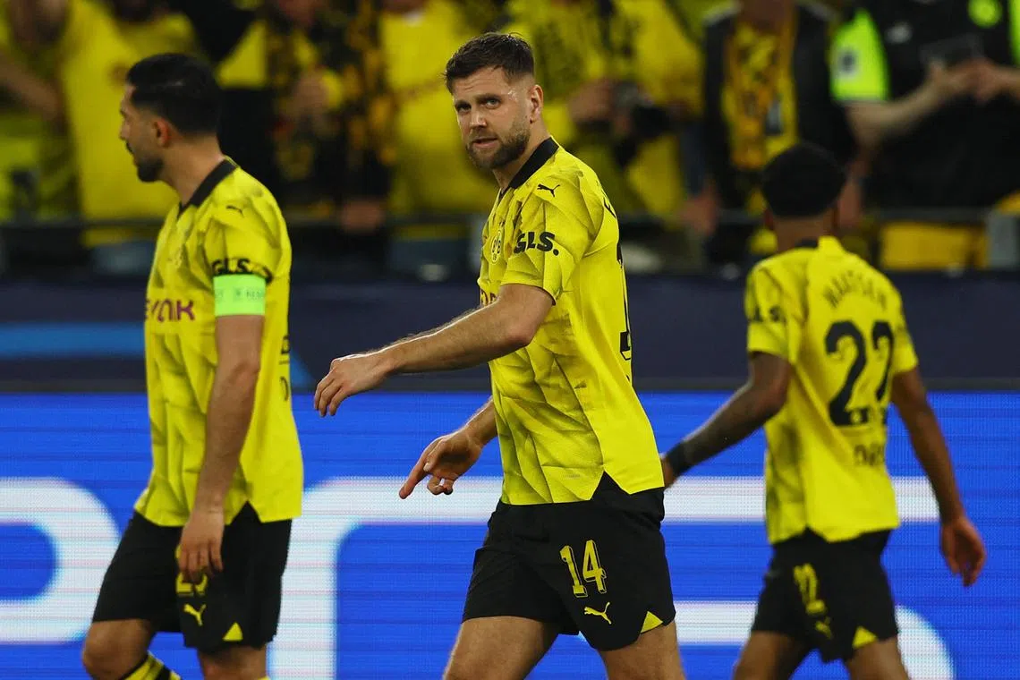 Soccer Football - Champions League - Semi Final - First Leg - Borussia Dortmund v Paris St Germain - Signal Iduna Park, Dortmund, Germany - May 1, 2024 Borussia Dortmund's Niclas Fullkrug celebrates scoring their first goal REUTERS/Thilo Schmuelgen