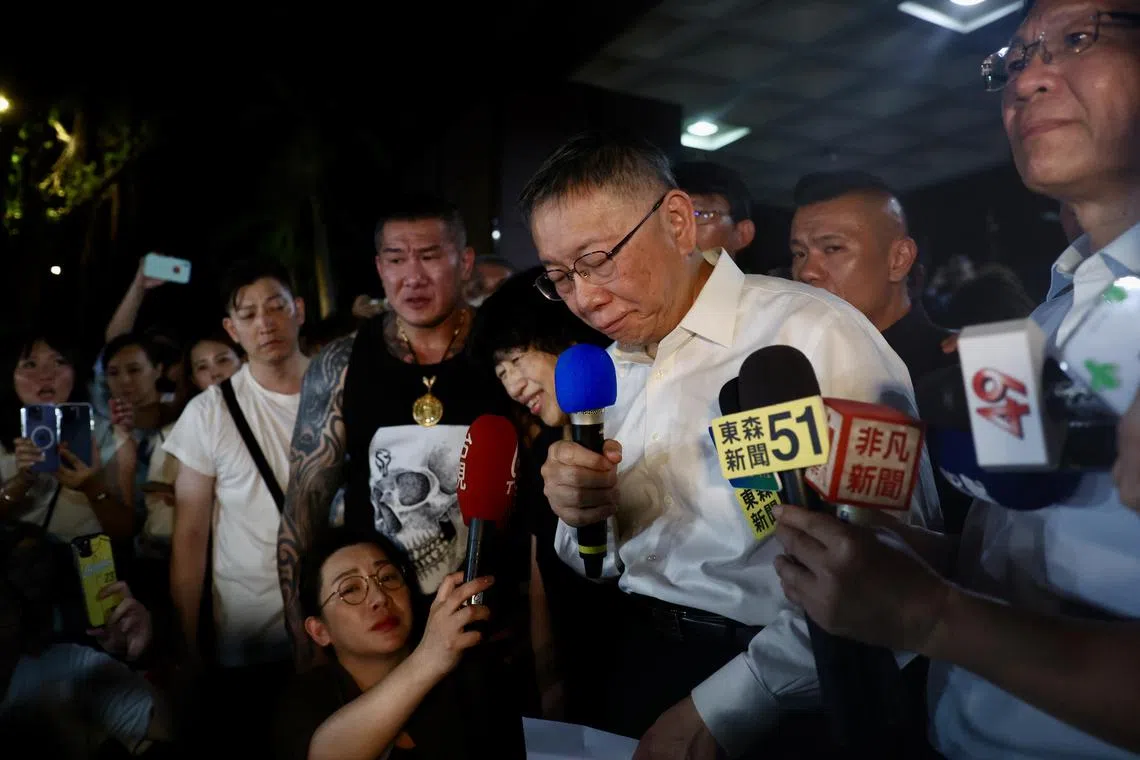 Former Taipei city mayor Ko Wen-je (centre),  speaks to supporters outside Taipei city District Court, in Taipei on Sept 2. He was released in the early morning after a court found him not guilty of the charges submitted by the prosecutor. 