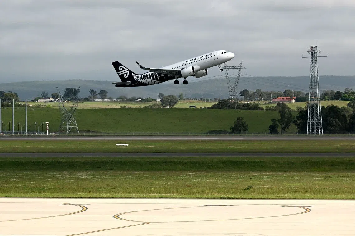 An Air New Zealand plane taking off as the first international flight to depart the newly opened Western Sydney International Airport on Oct 26.