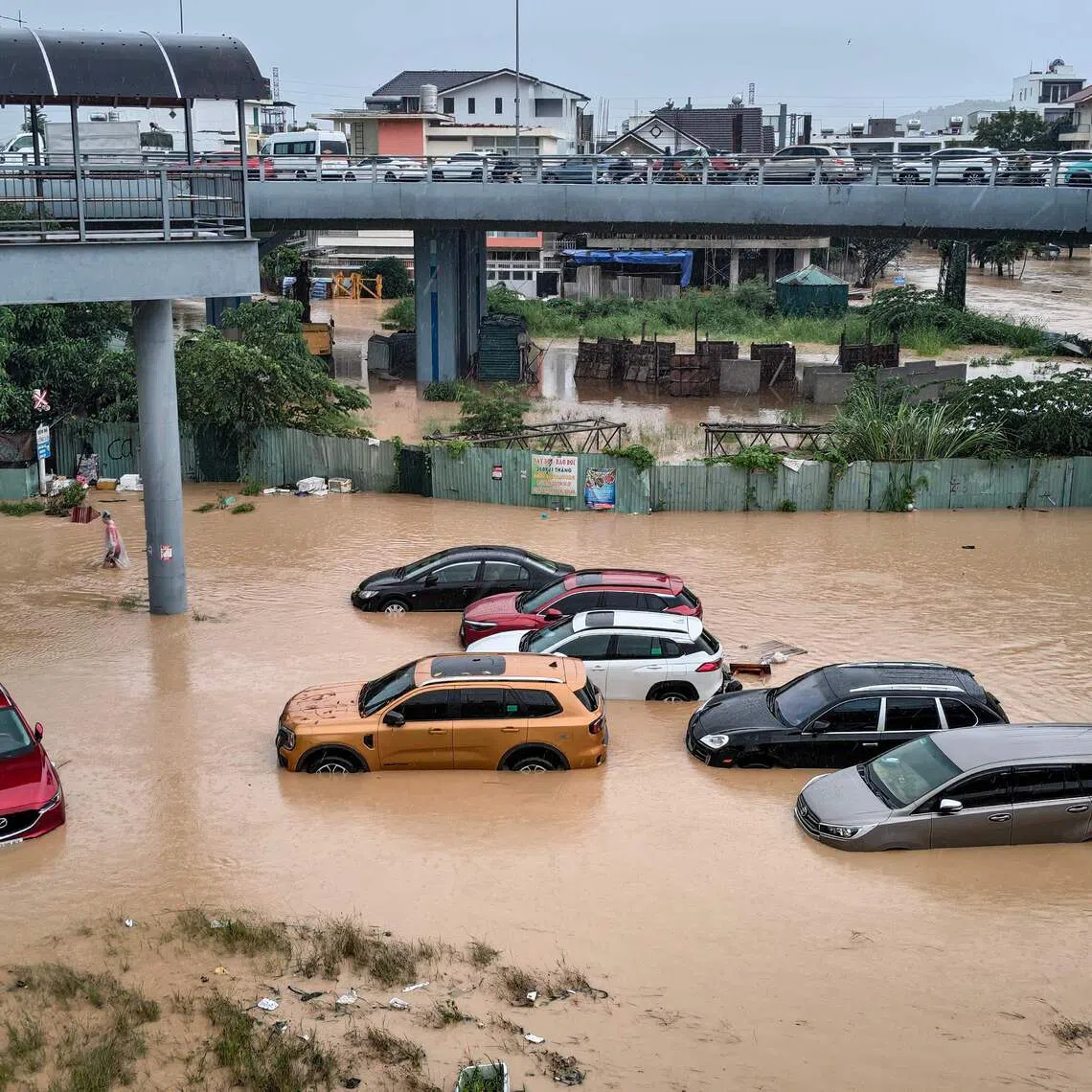 Floodwaters near inundated vehicles in Nha Trang, Vietnam's coastal province of Khanh Hoa on Nov 20.