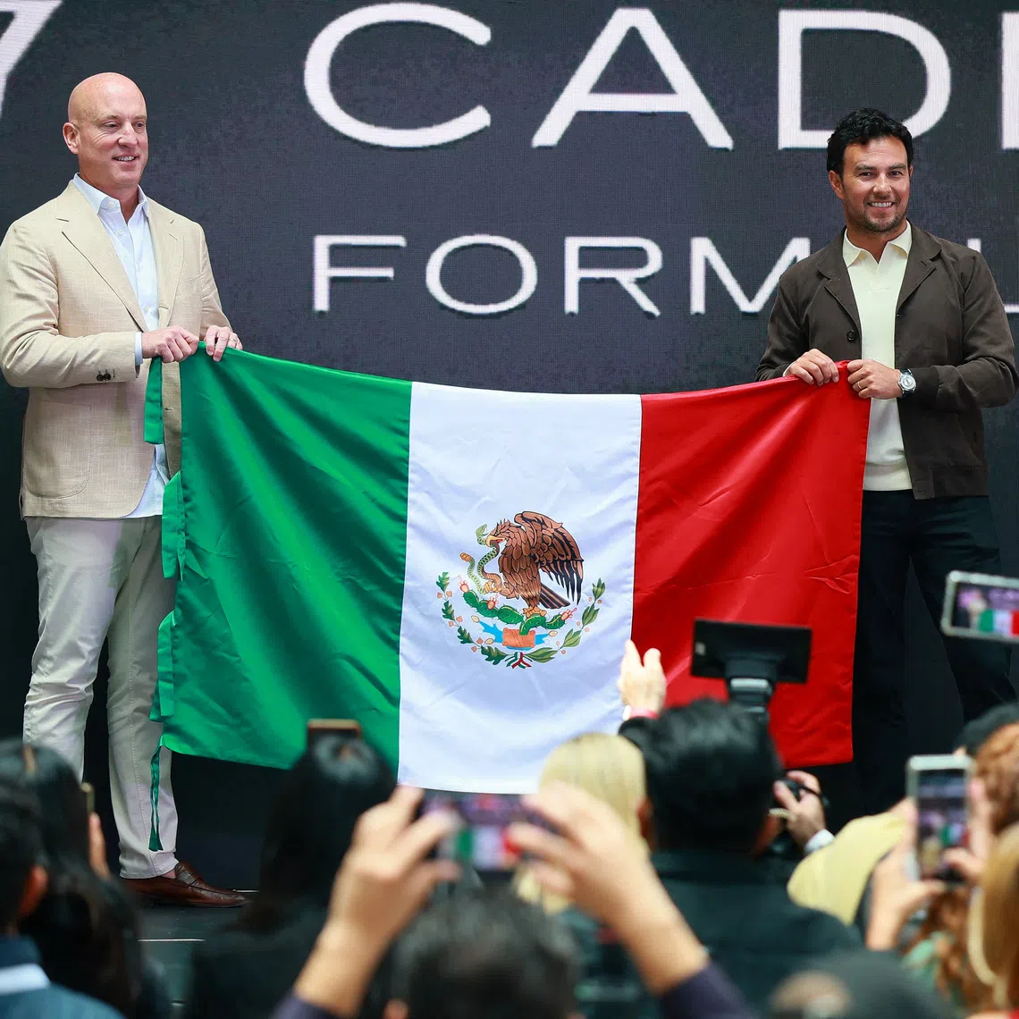 Cadillac F1 team CEO Dan Towriss (left) and Sergio Perez in August.