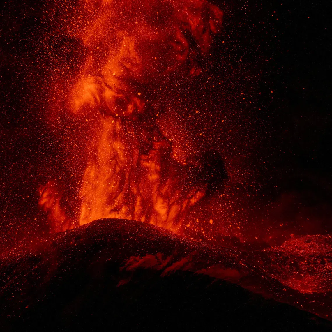 Lava is ejected from a crater during an eruption of Mount Etna, in Sicily, Italy, on Aug 13.