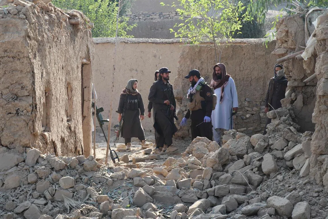 Taliban security personnel inspect the site, after Pakistani air strike struck Gurbuz district in Afghanistan’s Khost province on Sept 24.