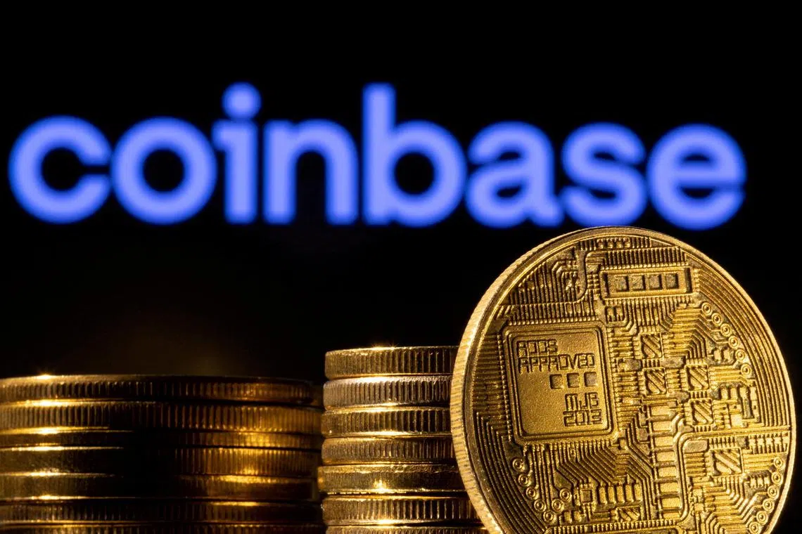 A representation of the cryptocurrency is seen in front of Coinbase logo in this illustration taken, March 4, 2022. REUTERS/Dado Ruvic/Illustration/File Photo