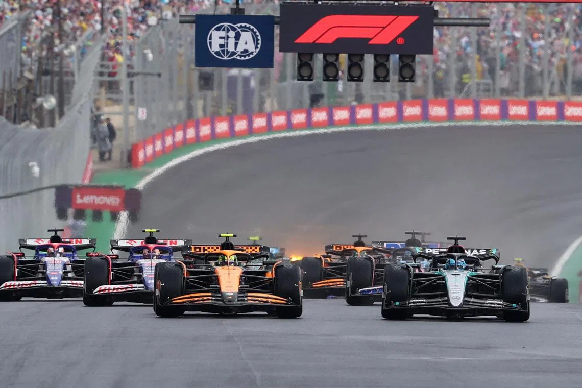 Formula One F1 - Sao Paulo Grand Prix - Autodromo Jose Carlos Pace, Sao Paulo, Brazil - November 3, 2024 McLaren's Lando Norris anf Mercedes' George Russell at the start of the race REUTERS/Carla Carniel/File Photo