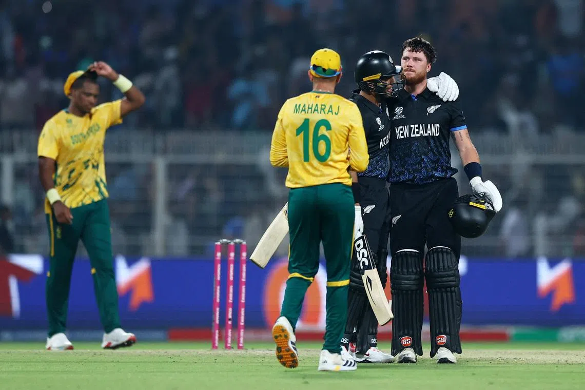 Cricket - ICC Men's T20 World Cup 2026 - Semi Final - South Africa v New Zealand - Eden Gardens, Kolkata, India - March 4, 2026 New Zealand's Finn Allen and Rachin Ravindra celebrate after the match REUTERS/Anushree Fadnavis