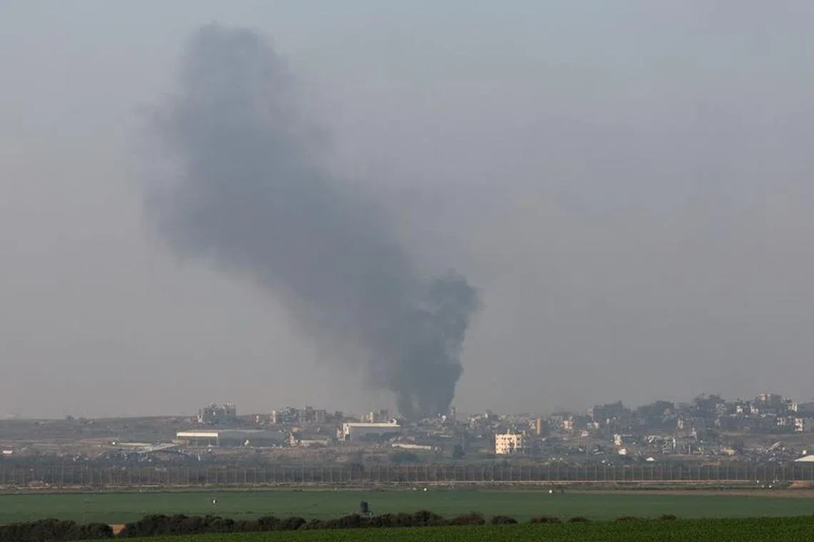 Smoke rises over Gaza, amid the ongoing conflict between Israel and the Islamist group Hamas, as seen from Israel, January 19, 2024. REUTERS/Tyrone Siu