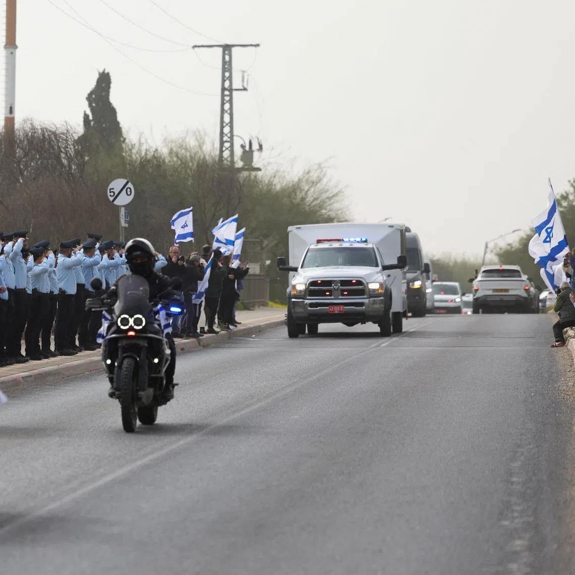 A convoy carrying the remains of Mr Ran Gvili, the last hostage to be retrieved from Gaza, in Ramla, Israel, on Jan 28.