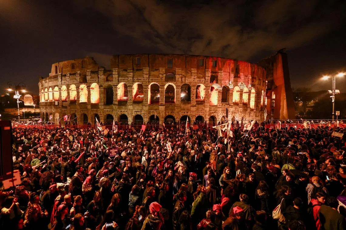 Protesters standing in front of the Colosseum during a demonstration to mark International Women's Day, in Rome, Italy on March 8, 2026. 