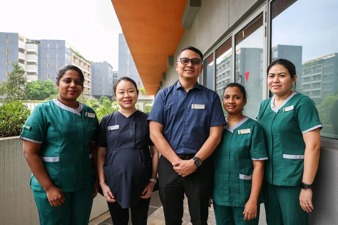 (From left) Anushiya Rajendran, assistant nurse clinician, Ren Ci @ Woodlands; Sharen Lim Pei Wen, consultant, Geriatric Medicine, Woodlands Hospital; De Sagun Dennis Hernandez, resident physician, Ren Ci @ Woodlands; Neduri Neelima, staff nurse, Ren Ci @ Woodlands; and Aring Abigail Domingo, staff nurse, Ren Ci @ Woodlands at Ren Ci @ Woodlands on June 24.