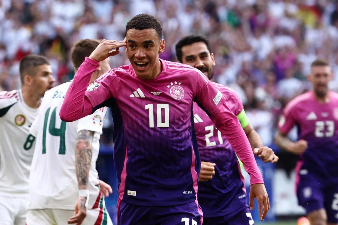 Germany's Jamal Musiala celebrates scoring their opening goal against Hungary.
