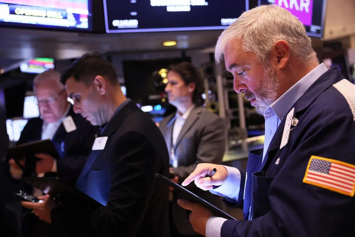NEW YORK, NEW YORK - MARCH 08: Traders work on the floor of the New York Stock Exchange, in New York City.