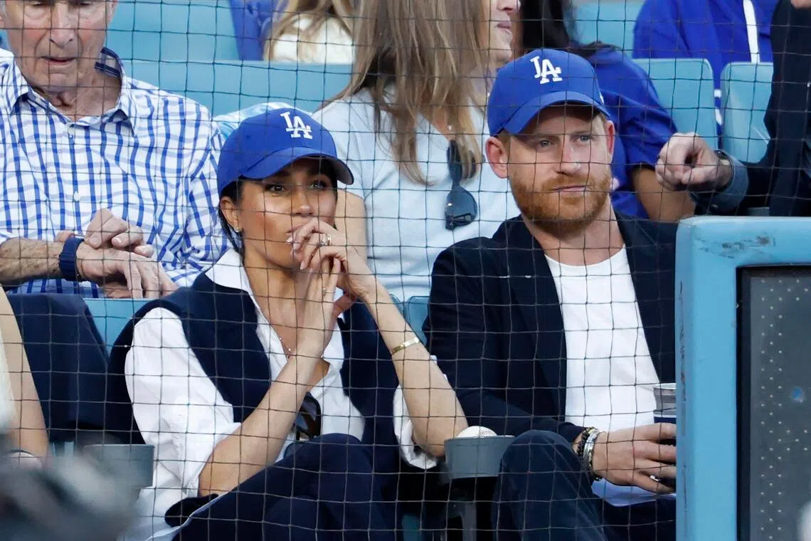 Prince Harry, Duke of Sussex and Meghan, Duchess of Sussex look on from the stands during Game 4 of the 2025 World Series between the Toronto Blue Jays and the Los Angeles Dodgers at Dodger Stadium on Oct 28. 