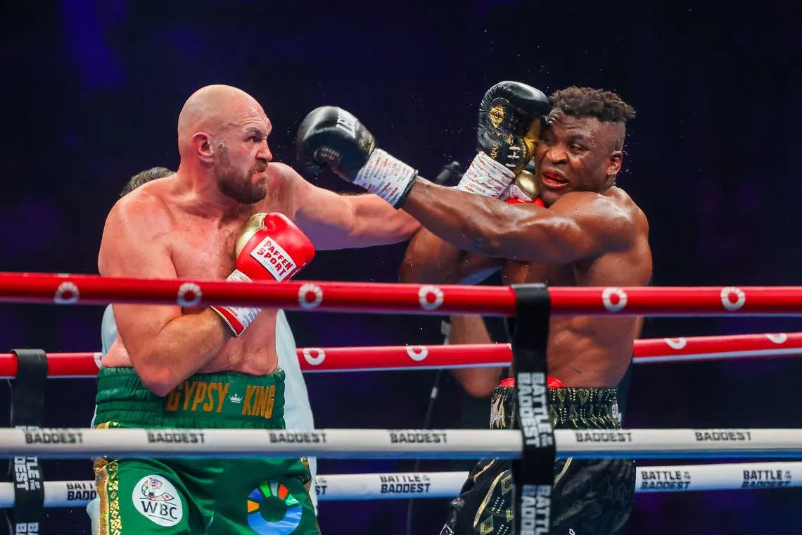 Britain's Tyson Fury fights against Cameroonian-French Francis Ngannou (right) during their heavyweight boxing match in Riyadh on Oct 29, 2023. 