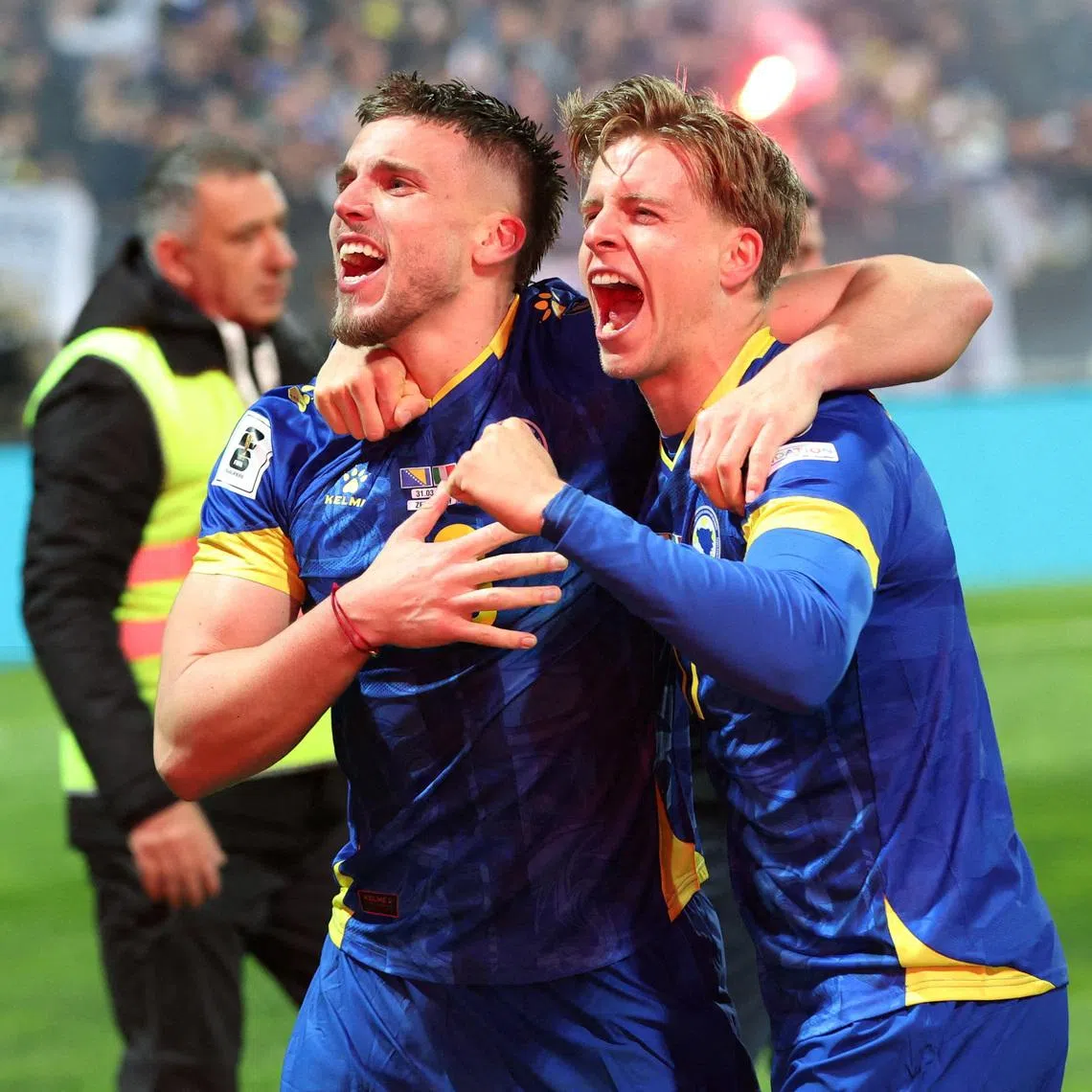 FILE PHOTO: Soccer Football - FIFA World Cup - UEFA Qualifiers - Finals - Bosnia and Herzegovina v Italy - Bilino Polje Stadium, Zenica, Bosnia and Herzegovina - March 31, 2026 Bosnia and Herzegovina's Ermedin Demirovic and Dzenis Burnic celebrate qualifying for the FIFA World Cup REUTERS/Amel Emric/File Photo