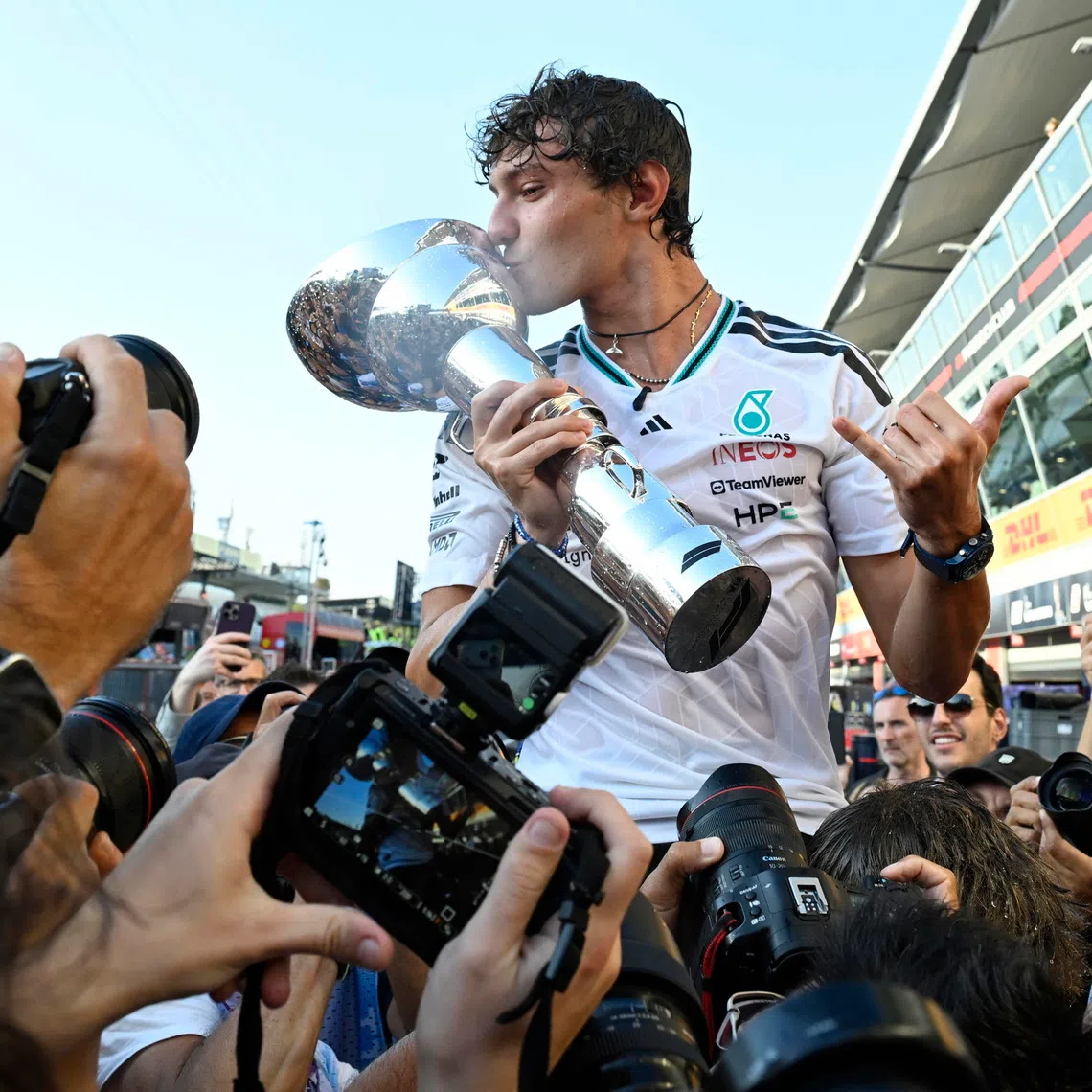 Mercedes driver Kimi Antonelli of Italy celebrates with the team winning the Formula One Grand Prix of Italy in Monza.