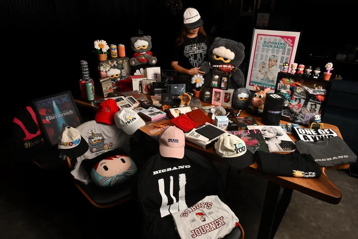 Priscilla Koh pictured at home with her merchandise collection on Sept 26. She is attending nearly every concert in BigBang’s 19-city XX: Cosmos world tour, skipping only the US and Europe stops.