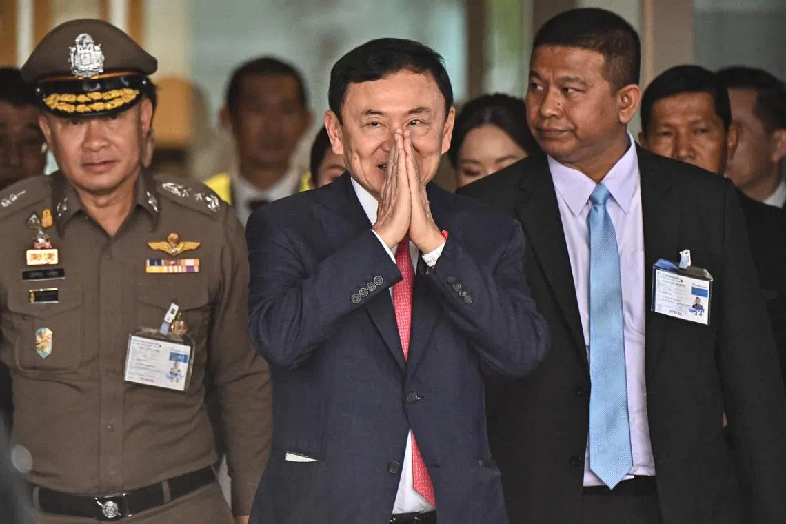 Former Thai premier Thaksin Shinawatra (centre) at Don Mueang airport in Bangkok, Thailand, on Aug 22.