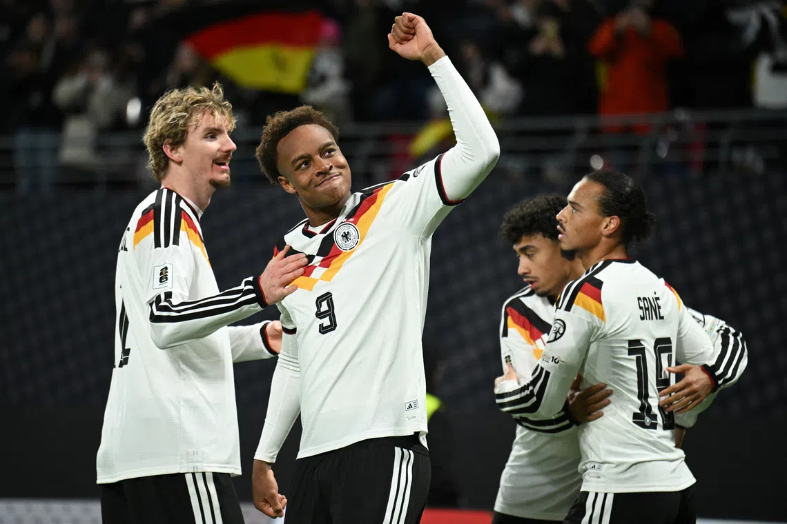 Soccer Football - World Cup - UEFA Qualifiers - Group A - Germany v Slovakia - Red Bull Arena, Leipzig, Germany - November 17, 2025 Germany's Assan Ouedraogo celebrates scoring their sixth goal with Nick Woltemade REUTERS/Annegret Hilse
