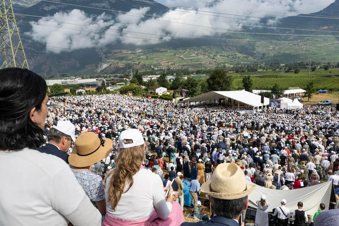 Worshippers gathering in Econe, Switzerland, on July 1 as four Catholic priests receive episcopal consecration during a pontifical mass organised by the Society of Saint Pius X.