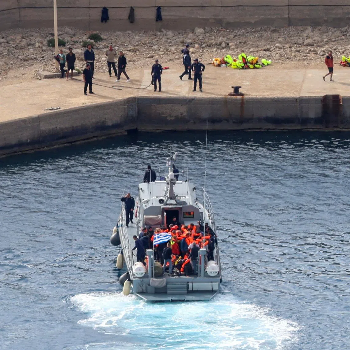 A coast guard vessel carrying activists of a Gaza-bound aid flotilla, intercepted by the Israeli Navy, to a port in Crete on May 1.  Israel said two of them were linked with a US-sanctioned group.